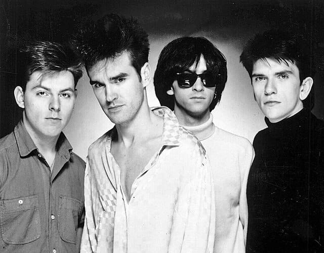 The Smiths in a promotional photograph for their debut album The Smiths, circa 1984. From left to right; Andy Rourke, Morrissey, Johnny Marr, and Mike Joyce. This photo was also issued later to promote their 1985 album Meat Is Murder.